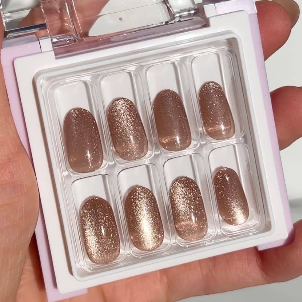 glittery brown press on nails in short length with round shape