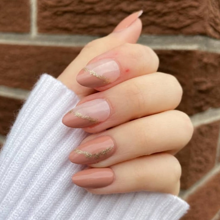 brown marble nails with gold accents medium length almond shape