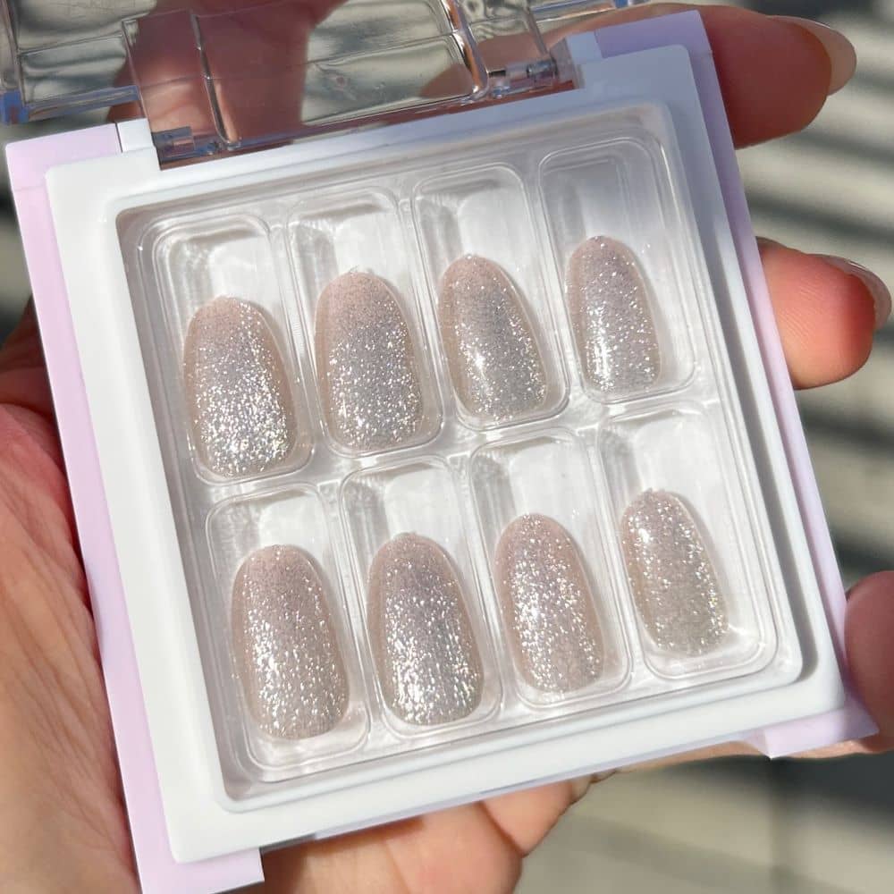 silver glitter nails in the sunlight