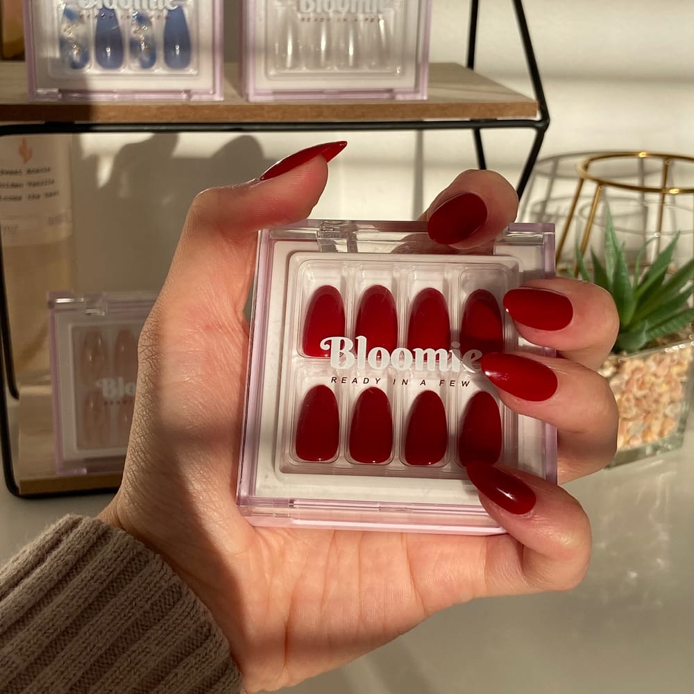 dark-red-press-on-nails-in-hand-vanity-photo