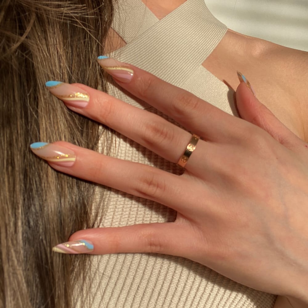 female-wearing-unicorn-press-on-nails-almond-shape-finish